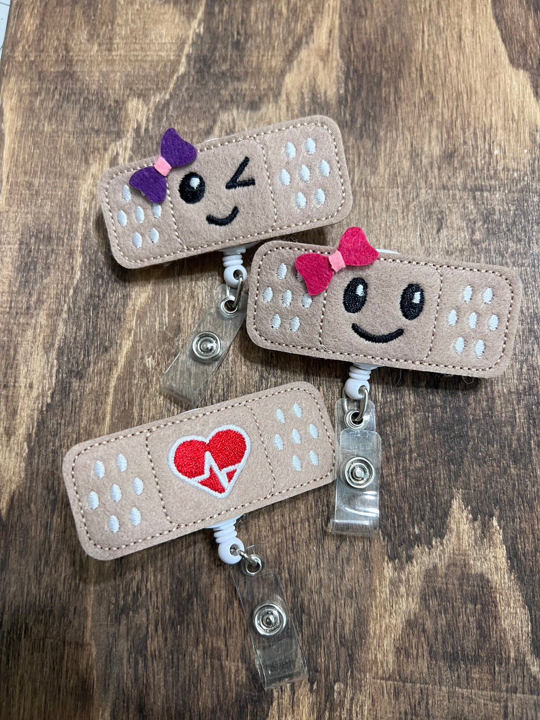 Band aid badge reels