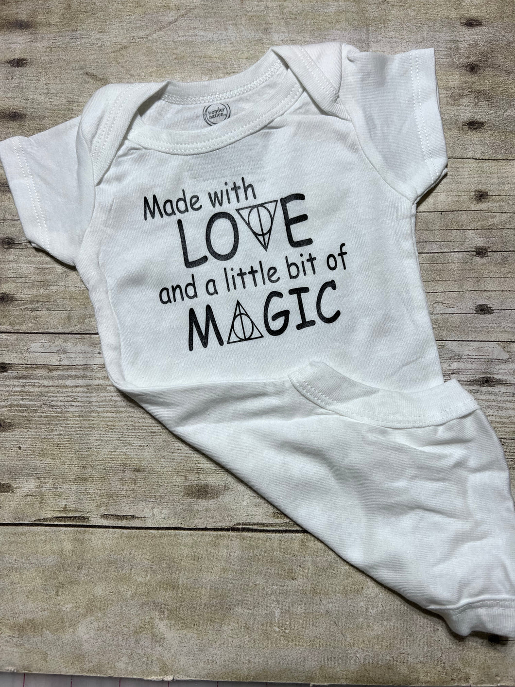 Made with love and magic baby one piece bodysuit